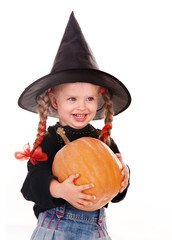 Child in costume Halloween witch  with pumpkin,  broom.