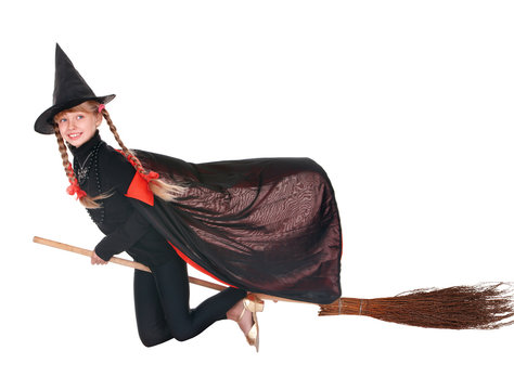 Child in costume Halloween witch  fly on  broom.