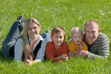 Fototapeta premium Family of four in the park