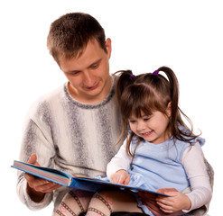 Happy family reading a book