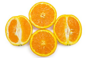 Slices of peeled orange on white background