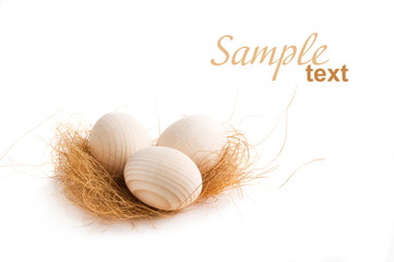 decorative eggs lying on some hay