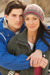 Romantic Young Couple On Winter Beach