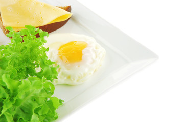 green lettuce and fried eggs