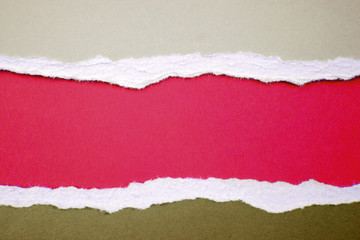 Ripped brown paper on red background