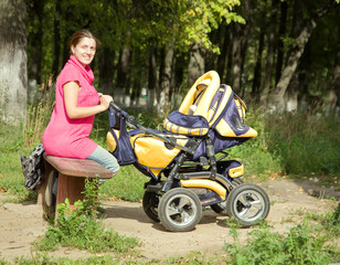 Woman  with pram in park