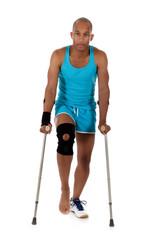 Young  attractive African American man athlete, crutches