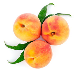 fresh peach fruits with green leaf