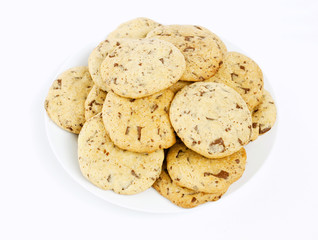 a plate full of homemade chocolate cookies on white