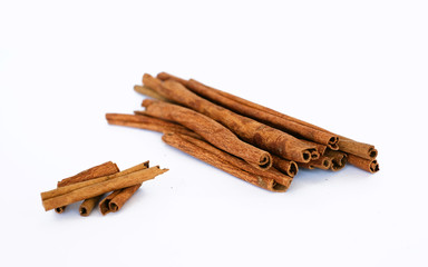 cinnamon sticks on whtie