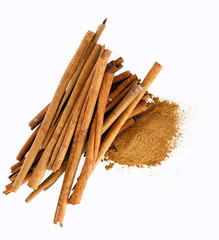 cinnamon sticks and powder on white background