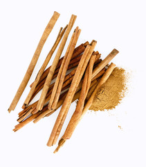cinnamon sticks and powder on white background