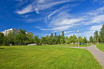 City park with windy clouds