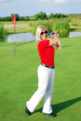 beauty blonde girl play golf