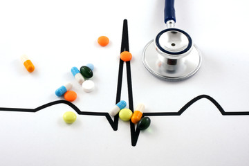 Stethoscope lying on ECG diagram - obrazy, fototapety, plakaty