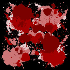 Red ink spots on black background