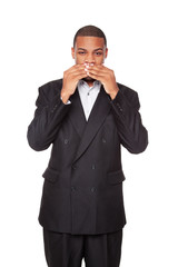 Speak No Evil - African American businessman isolated on white