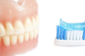 Tooth paste and denture - obrazy, fototapety, plakaty