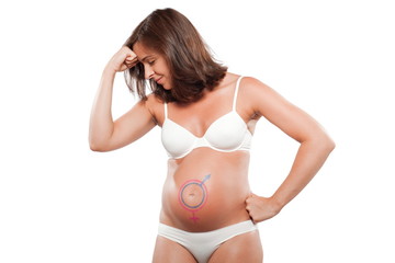 Fototapeta premium Pregnant woman with female male sign symbol drawn on the belly