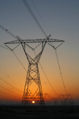 Electricity pylons at sunset
