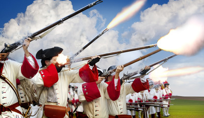 soldiers firing their muskets in a battlefield