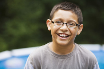 Smiling mixed race boy in eyeglasses