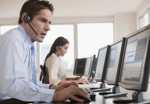 Hispanic businessman working on computer