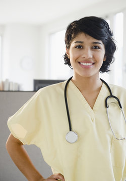 Hispanic nurse in scrubs with stethoscope