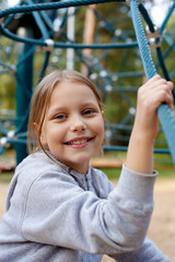 Outdoor portrait of smiling little girl