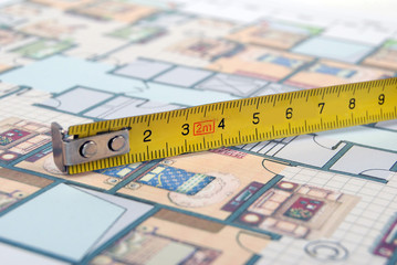 steel tape on house plans