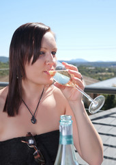 young woman with glass of wine