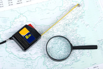 magnifier,steel tape with map