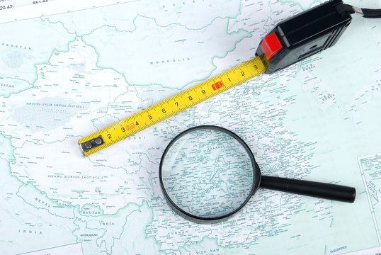 magnifier,steel tape with map