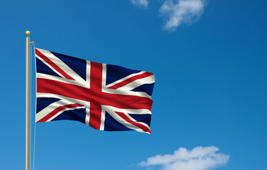 Flag of the United Kingdom waving in front of blue sky