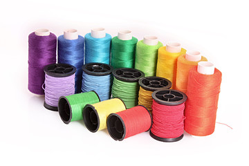 Few bobbins isolated on white