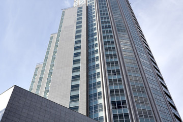 Obraz premium textured glass wall, modern building skyscraper of business cent