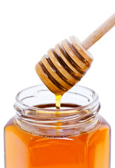 Cuillère à miel et pot de miel