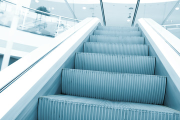 perspective view to moving staircase in metro station