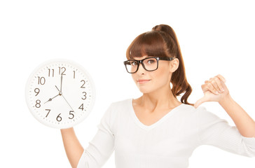 woman holding big clock