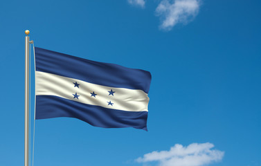 Flag of Honduras waving ni the wind in front of blue sky