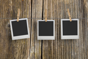 Old film frames blanks on a rope, historical polaroid photo