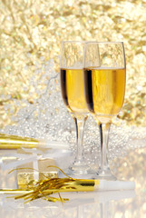 two glasses champagne with gift and horns
