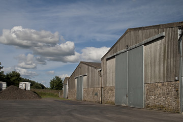 Fototapeta na wymiar Three farm grain sheds