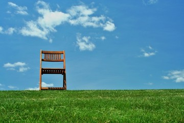 Wooden chair on a hilltop