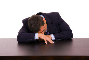 mature business man sleeping on the desk