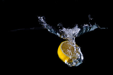 Lemon splash on black background