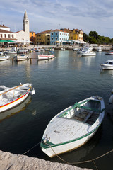 Fototapeta na wymiar Fishing boats in harbor of Fazana