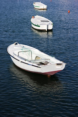 Three wooden fishing boats