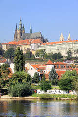 View on the summer Prague gothic Castle above River Vltava