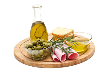 bread, ham, green olives, olive oil and rosemary